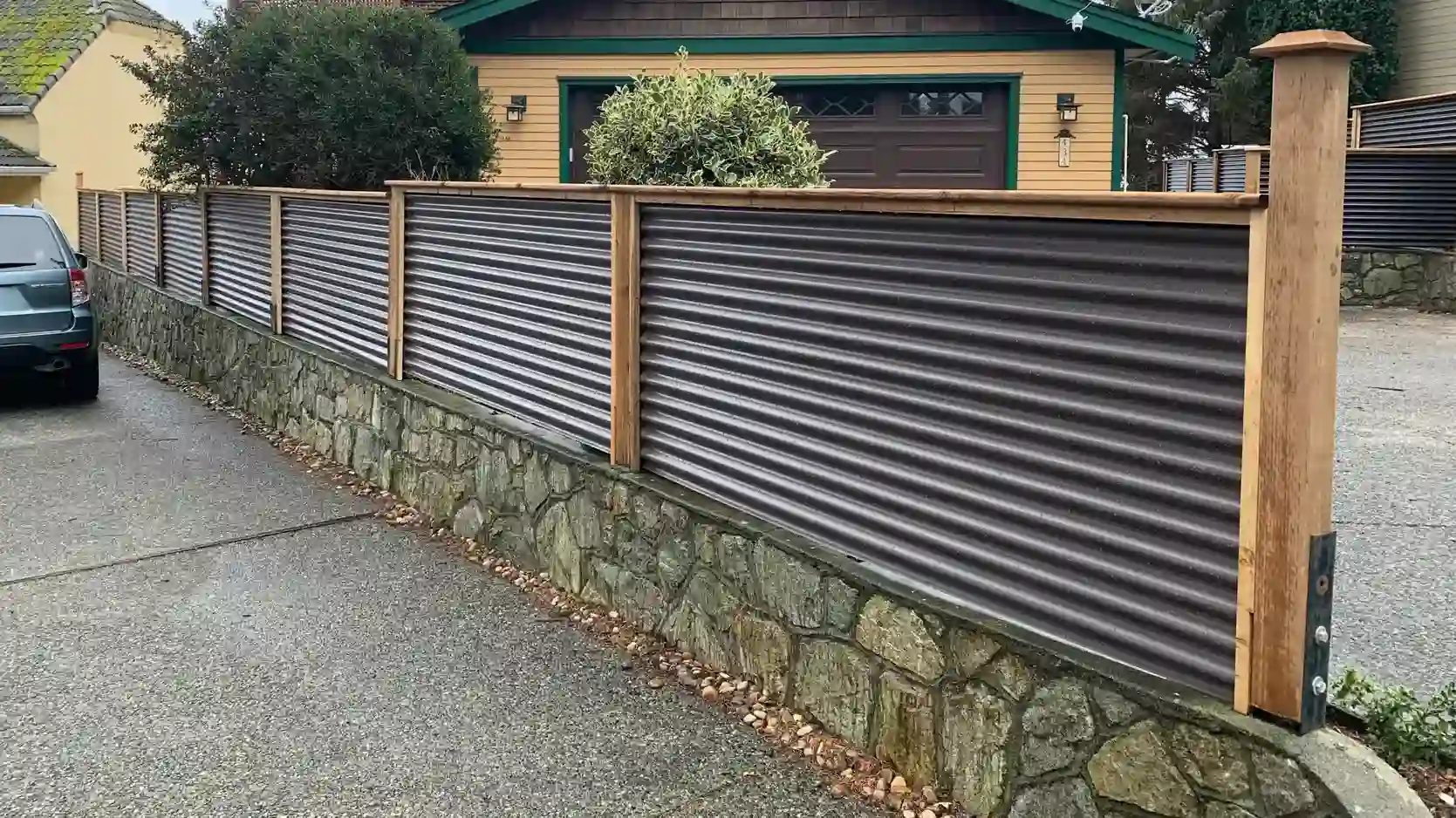 A corrugated metal fence by Rocky Point Fence and Deck.
