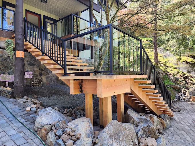 A staircase with railing built by Rocky Point Fence and Deck.